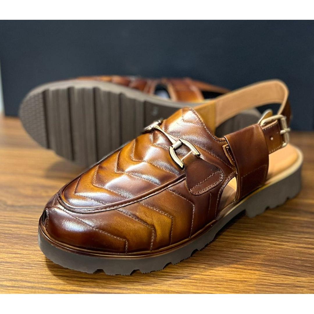 A stylish brown leather sandal with a quilted design on the front,