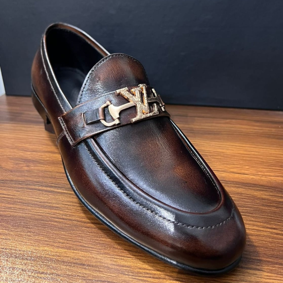 "Luxury Brown Leather Loafers with Gold Emblem – Signature Style"