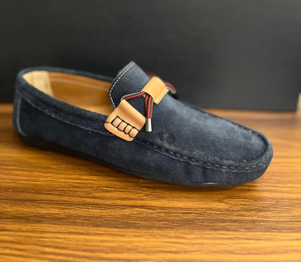 "Stylish Navy Blue Suede Loafers with Tan Strap Detail"